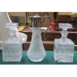 PLATED TOPPED GLASS CLARET JUG AND PAIR OF GLASS DECANTERS