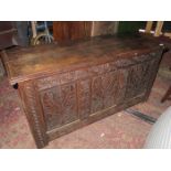 HEAVILY CARVED OAK BLANKET CHEST