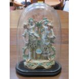 UNGLAZED CONTINENTAL STYLE CERAMIC FIGURE GROUP UNDER VICTORIAN GLASS DOME,
