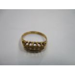 18ct GOLD DRESS RING SET WITH FIVE SMALL CLEAR STONES