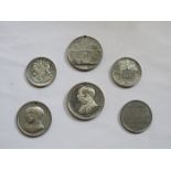 SIX VARIOUS SILVER COLOURED COMMEMORATIVE COINS