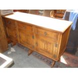 PRIORY STYLE OAK THREE DRAWER SIDEBOARD