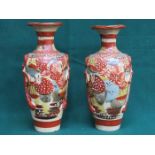 PAIR OF ORIENTAL HANDPAINTED AND GILDED CERAMIC VASES