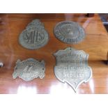 FOUR VINTAGE BRASS ADVERTISING PLAQUES