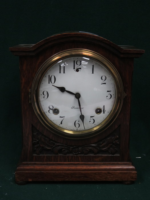 CARVED OAK CASED MANTEL CLOCK