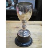 HALLMARKED SILVER CUP ON EBONISED BASE,