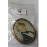 18th/19th CENTURY OVAL MINIATURE PORTRAIT OD A YOUNG GENT WITHIN FREE STANDING GOLD COLOURED FRAME