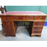 LEATHER TOPPED PEDESTAL WRITING DESK