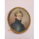 18th/19th CENTURY OVAL MINIATURE PORTRAIT OF A YOUNG GENT WITHIN FREE STANDING GILT FRAME