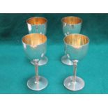 SET OF FOUR MODERN HALLMARKED HAMMERED SILVER GOBLETS WITH GILT INTERIORS,