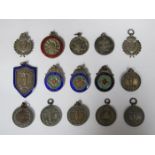 MIXED LOT OF VARIOUS SILVER AND SILVER COLOURED FOBS, SOME ENAMELLED,