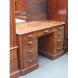 MAHOGANY KNEE HOLE WRITING DESK FITTED WITH NINE DRAWERS