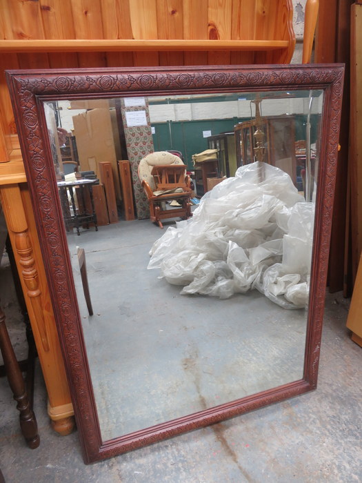 CARVED WOODEN FRAMED BEVELLED MIRROR,