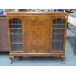 SIDE BY SIDE WALNUT AND MAHOGANY DISPLAY CABINET