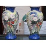 PAIR OF LARGE TUBE LINED HANDPAINTED AND GILDED CERAMIC VASES, IN THE STYLE OF MOORCROFT,