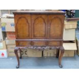 WALNUT VENEERED AND CARVED THREE DOOR,