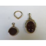 TWO GOLD COLOURED ROTATING FOB PENDANTS AND RING