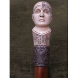 SILVER BANDED BIRDS EYE MAPLE WALKING STICK WITH CARVED IVORY(?) PHRENOLOGY BUST TOP