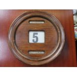 OAK CASED CIRCULAR DESK CALENDAR