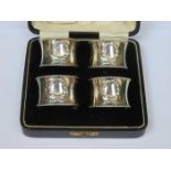 CASED SET OF FOUR HALLMARKED SILVER NAPKIN RINGS,