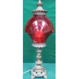 DECORATIVE CAST METAL TABLE LAMP WITH RUBY COLOURED GLASS SHADE