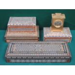 FOUR VARIOUS IVORY AND MOTHER OF PEARL INLAID STORAGE BOXES AND BRASS COLOURED CLOCK