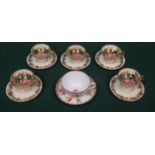 SET OF FIVE GILDED AND FLORAL CUPS AND SAUCERS, SIGNED,