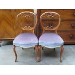 PAIR OF CARVED BALLOON BACKED DINING CHAIRS