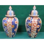 PAIR OF ORIENTAL STYLE HANDPAINTED AND GILDED CERAMICS VASES WITH COVERS,