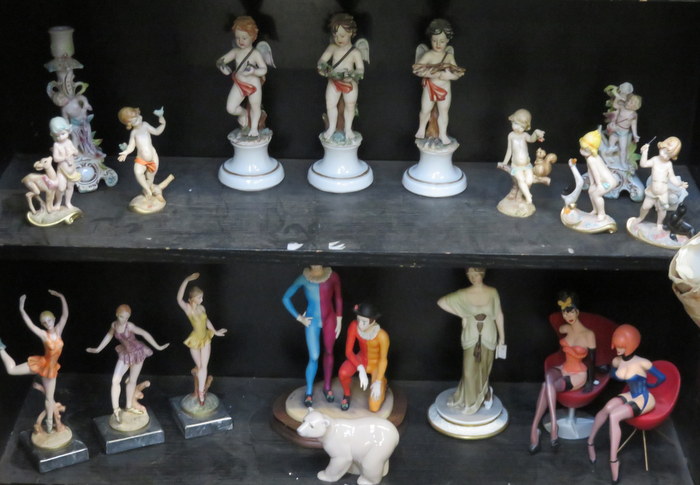 TWO SHELVES OF VARIOUS CONTINENTAL STYLE CERAMIC FIGURES