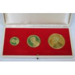 CASED SET OF THREE 18ct GOLD PRESIDENT KENNEDY MEMORIAL MEDALS,