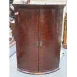 ANTIQUE MAHOGANY BOW FRONTED CORNER CUPBOARD