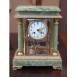 DECORATIVE GILT METAL AND ONYX MANTEL CLOCK WITH ENAMELLED AND CIRCULAR DIAL