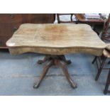 MAHOGANY SHAPED TOPPED TABLE ON CARVED CLAW SUPPORTS