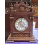 OAK CASED MANTLE CLOCK WITH ENAMELLED AND GILDED DIAL