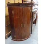 INLAID ANTIQUE MAHOGANY BOW FRONTED CORNER CUPBOARD