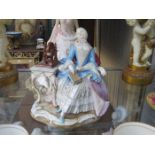 MEISSEN HANDPAINTED AND GILDED CERAMIC SEATED FIGURE