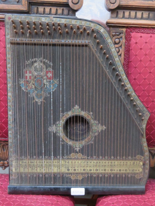 DECORATIVE EBONISED "GUITAR ZITHER" (AT FAULT)