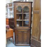 CARVED FRONTED OAK GLAZED CORNER DISPLAY CABINET