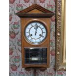 OAK CASED WALL CLOCK WITH ENAMELLED DIAL