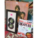 MOUNTED BEATLES JIGSAW, FRAMED CONTAINING TWO SINGLES,