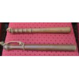TWO VINTAGE TREEN POLICE TRUNCHEONS