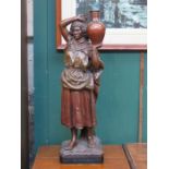 CONTINENTAL PAINTED TERRACOTTA FIGURE OF A WATER CARRIER (AT FAULT),