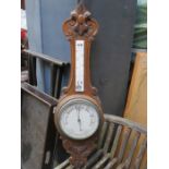 CARVED OAK ANEROID BAROMETER