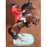 BESWICK GLAZED CERAMIC FIGURE OF A HUNTSMAN ON A REARING HORSE, No 868,