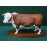 BESWICK UNGLAZED CERAMIC FIGURE- HEREFORD BULL, ON WOODEN MOUNT,