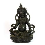 A Tibetan bronze figure of a seated guardian Deity, H. 22cm.