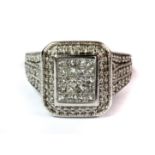 A white metal (tested 10ct) ring set with approx. 1ct of princess and brilliant cut diamonds (K).