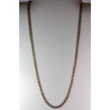 A 9ct yellow gold flat curb chain necklace, L. 30cm, (approx. 13.6gr).