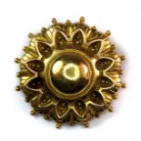 A yellow metal (tested 14ct yellow gold) embossed brooch, Dia. 3cm (approx. 4.6gr).